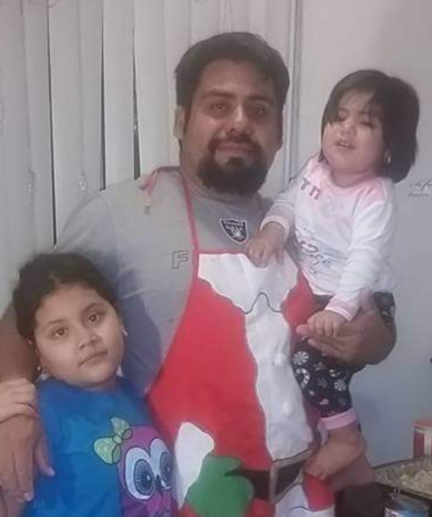 father with young and toddler daughters