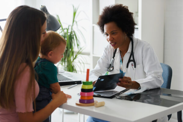 medical professional woman with toddler and mother