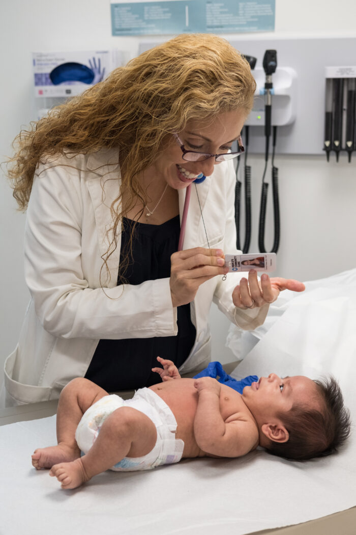 doctor with infant in exam room