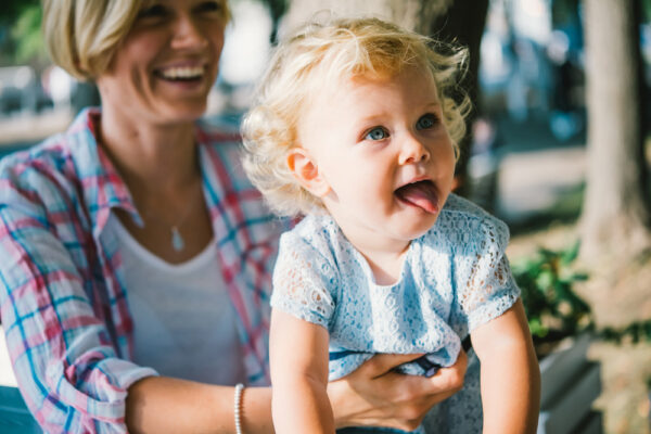 Toddler being held by mother